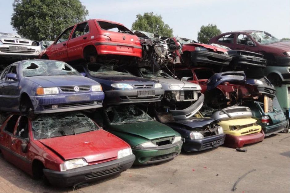 scrap cars stacked 